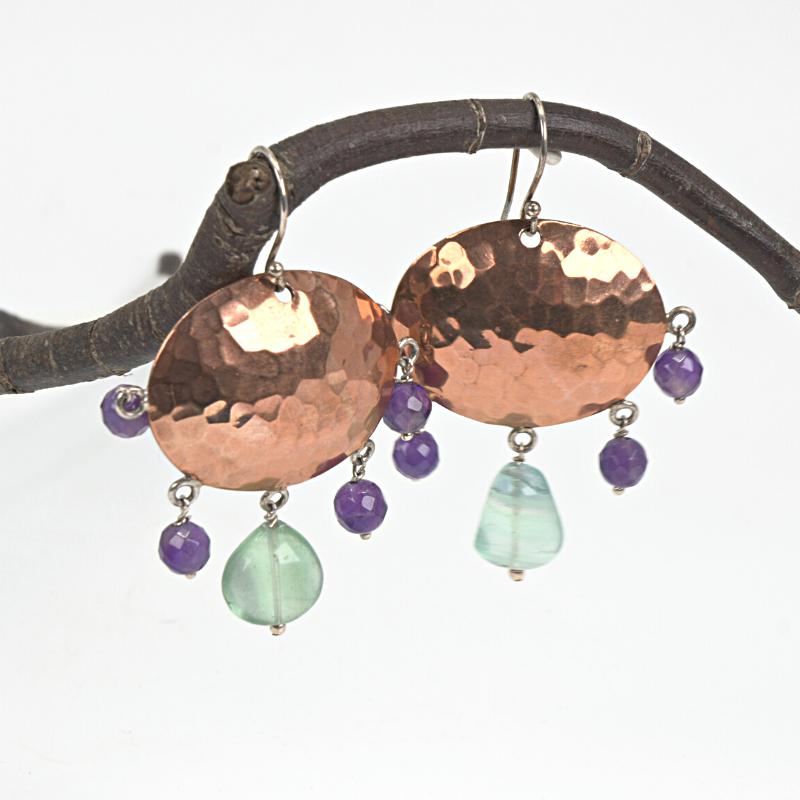 Hammered copper earrings with with fluorite and amethyst stones on sterling silver ear hooks. Designed and handcrafted by Ula Frou creator Sadie Hodson on Salt Spring Island.